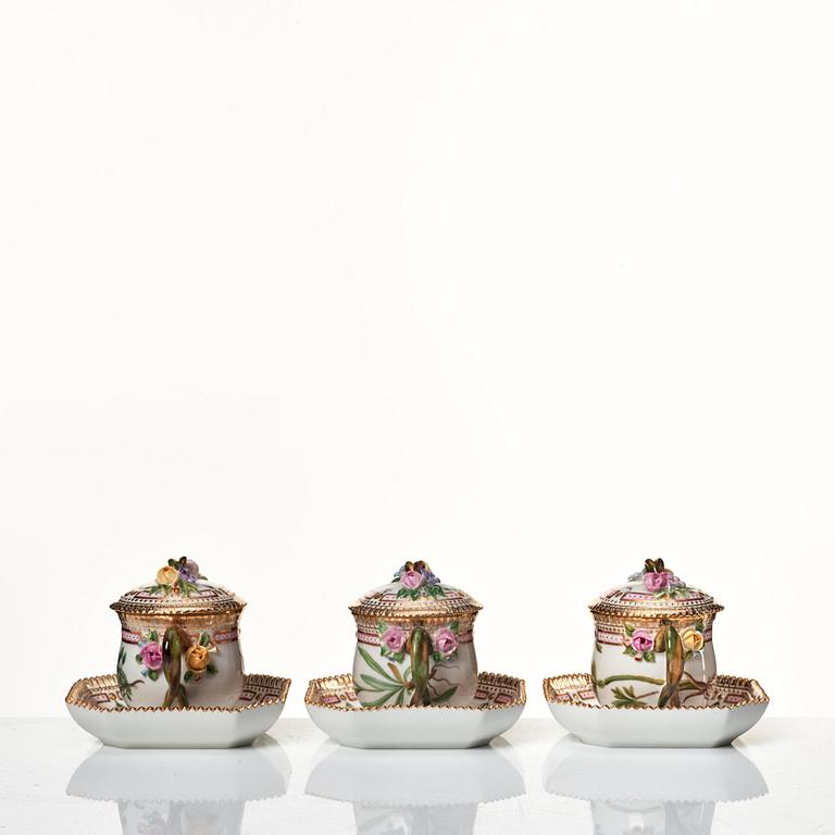 A set of 12 Royal Copenhagen 'Flora Danica' custard cups with covers and stands, Denmark, 20th Century.