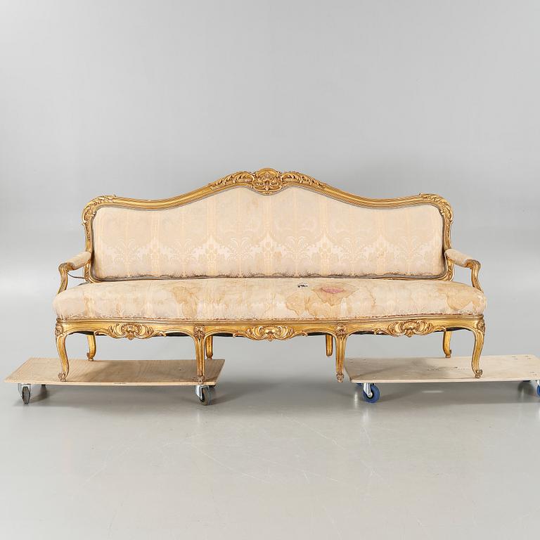 A rococo sofa from the first half of the 20th century.