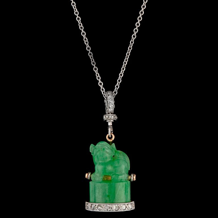 A carved jade and rose cut diamond pendant, c. 1900.