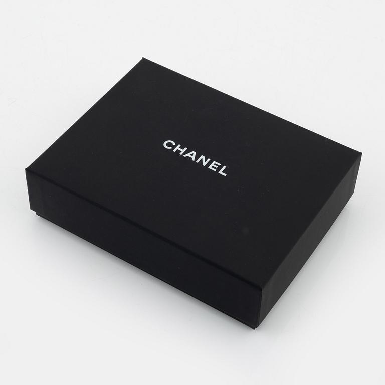 Chanel, a pair of polyurethane and lambskin gloves, size 7.