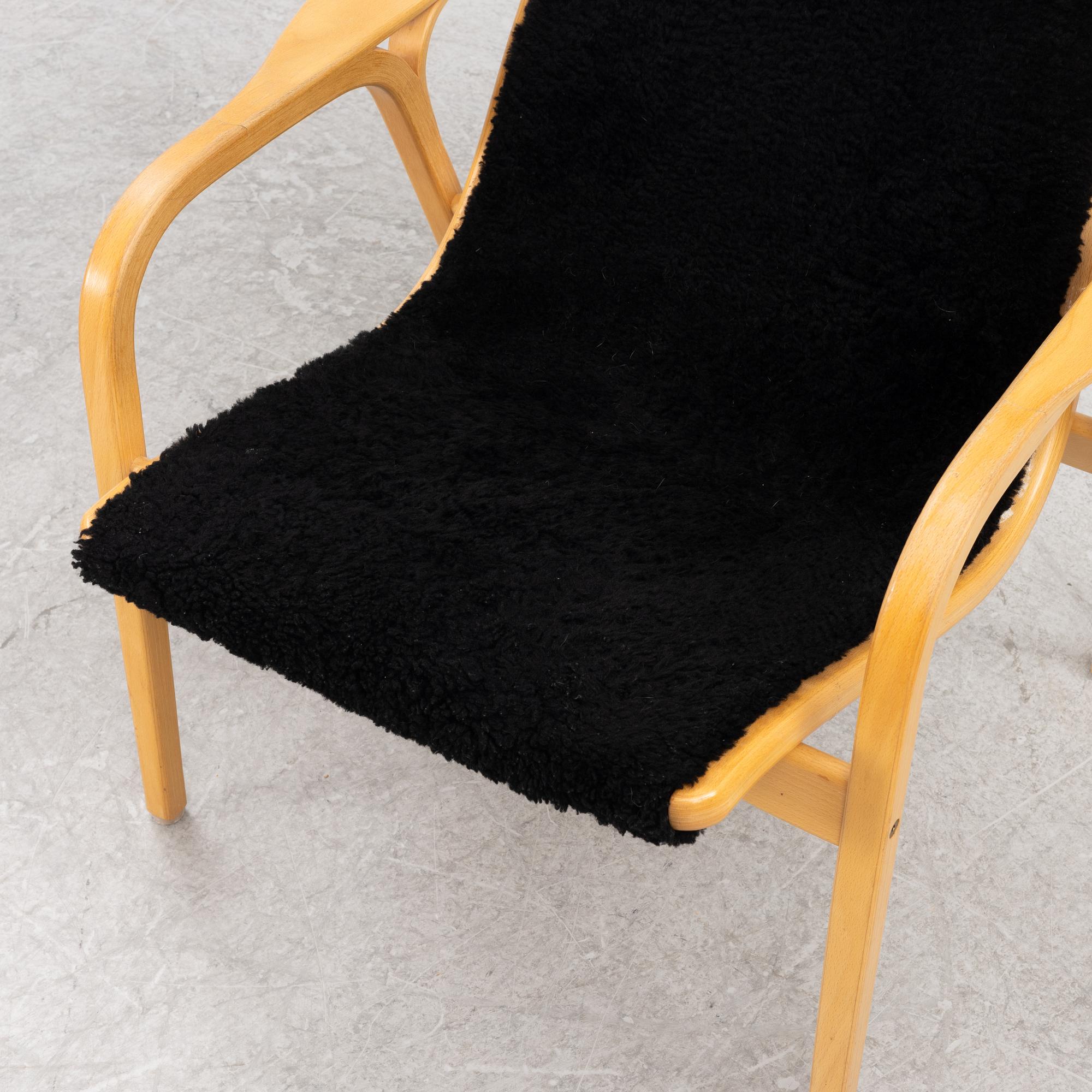 Yngve Ekström, an armchair and a footstool, "Lamino", Swedese, second half of the 20th century.