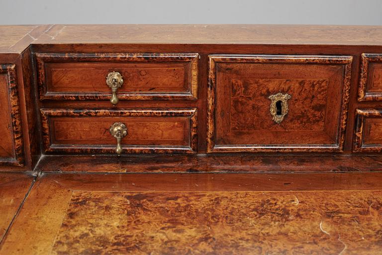 A Swedish late Baroque alder-veneered 'knee-hole' writing desk, first part of the 18th century.