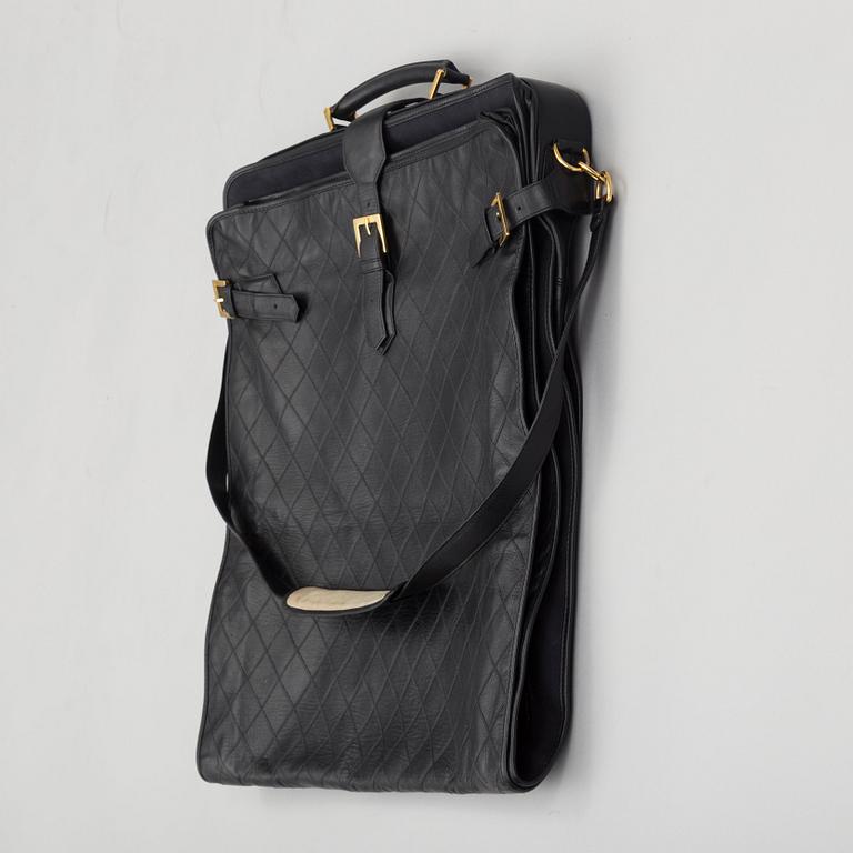 a CHANEL garment bag.