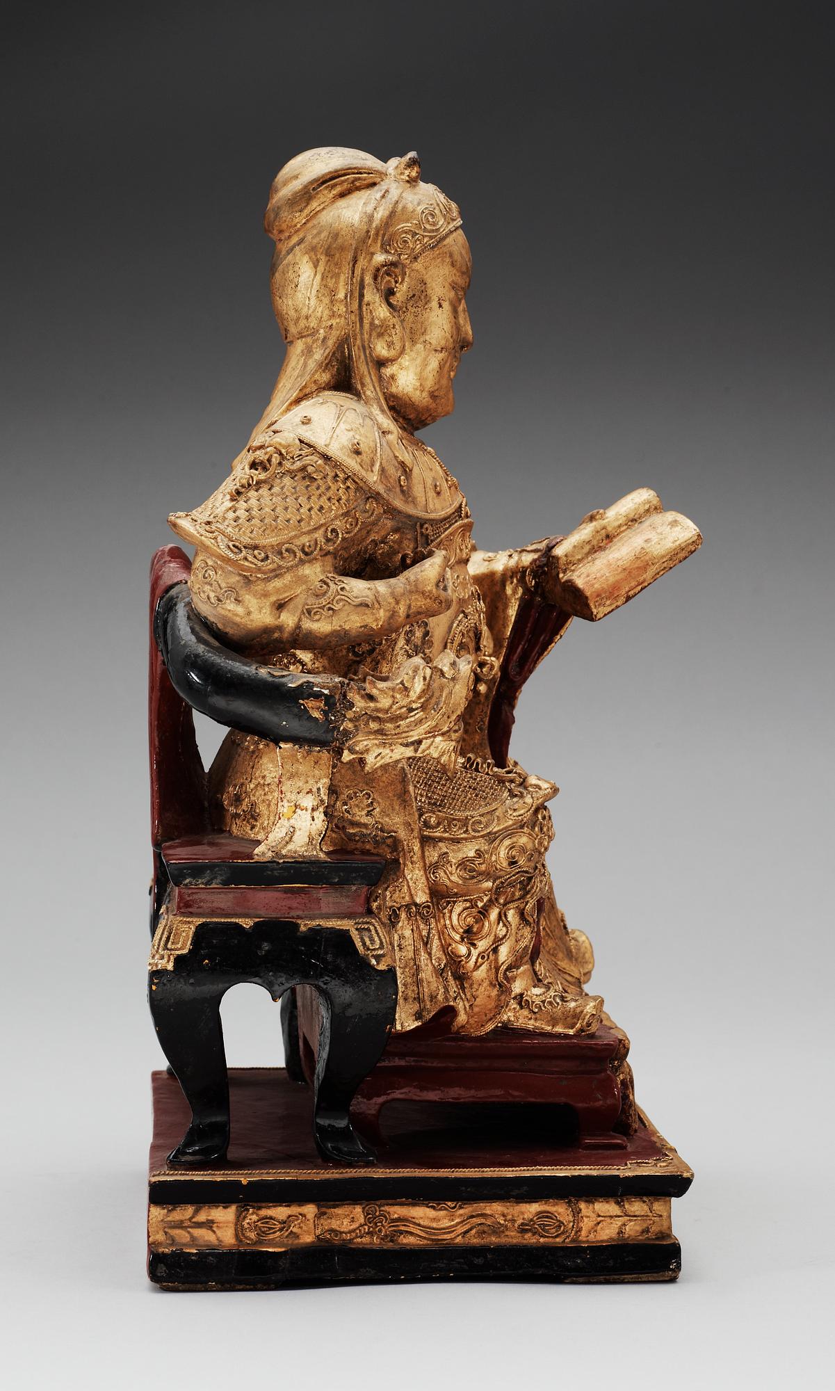 A wooden, gilt and lacquered figure of an chinese general, Qing dynasty, presumably Qianlong (1736-95).