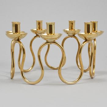 LJUSSTAKE, mässing, Lars Holmström, Arvika, 1900-talets andra hälft.