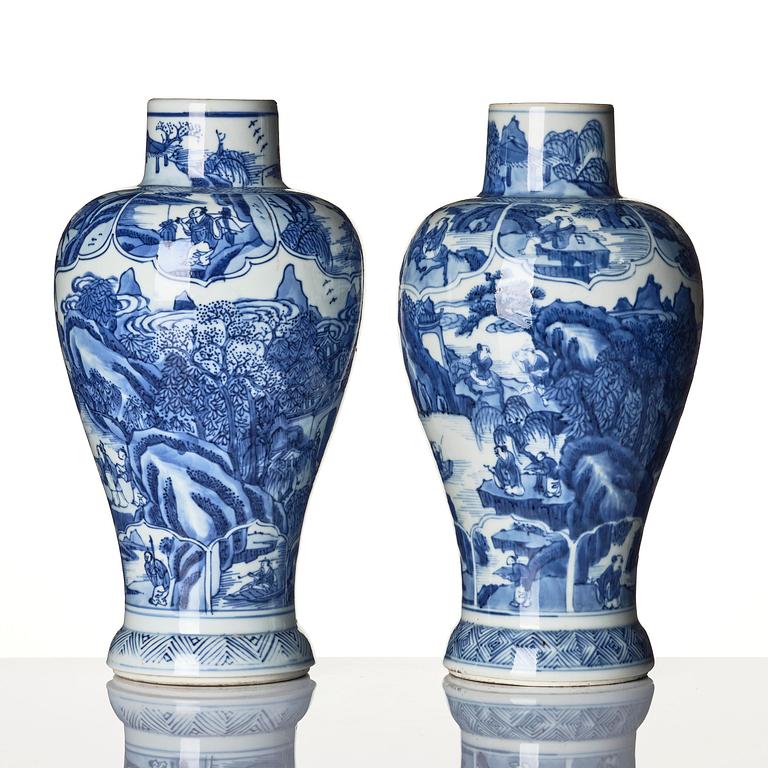 A pair of blue and white 'landscape' vases, Qing dynasty, Kangxi (1662-1722).