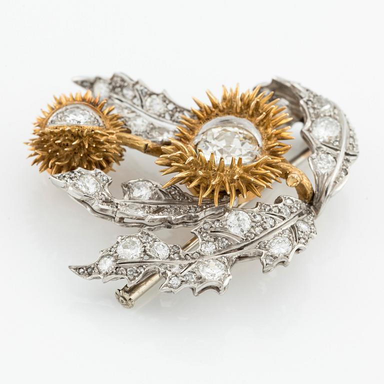 A platinum and 18K gold brooch with an old-cut diamond approximately 1.50 cts.