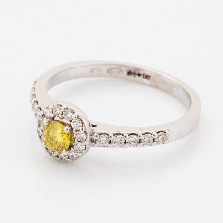 Yellow colour treated diamond and brilliant-cut diamond ring.