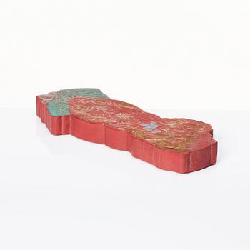 A red Chinese ink stick, 20th Century.
