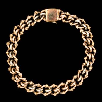 ARMLÄNK, 18 k vit och rött guld. Vikt ca 32 g.
