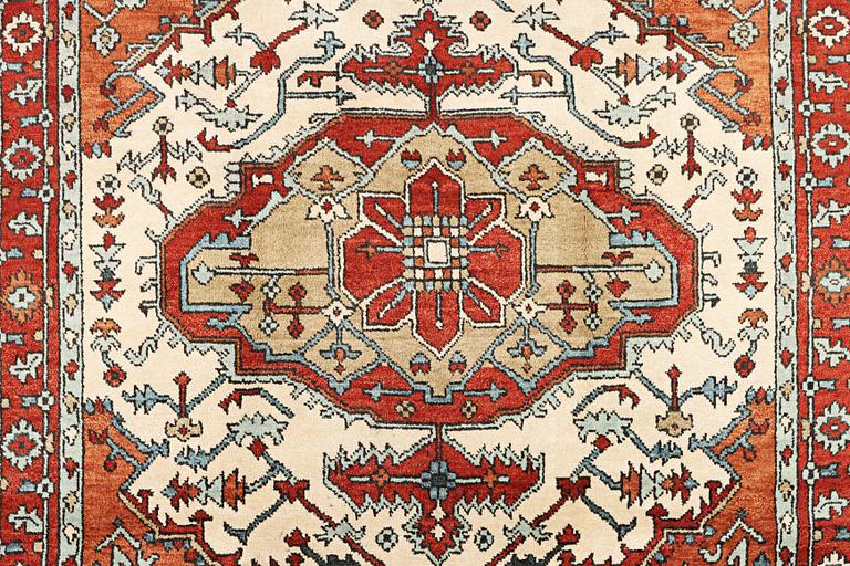 An oriental carpet, c. 296 x 238 cm.