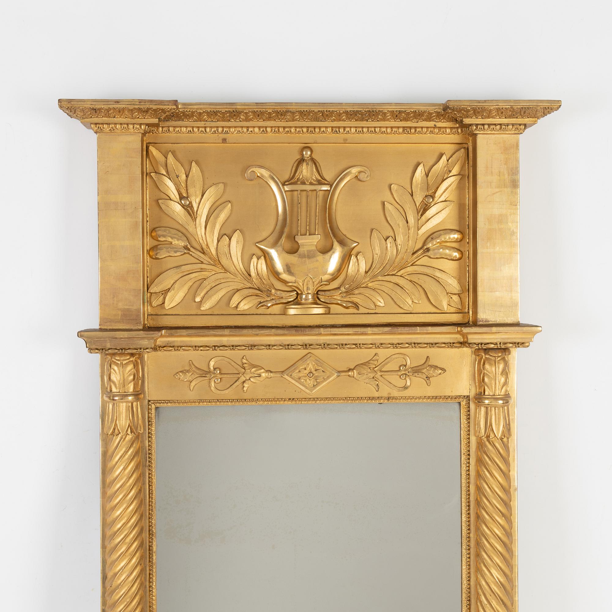 An Empire mirror, first half of the 19th Century.