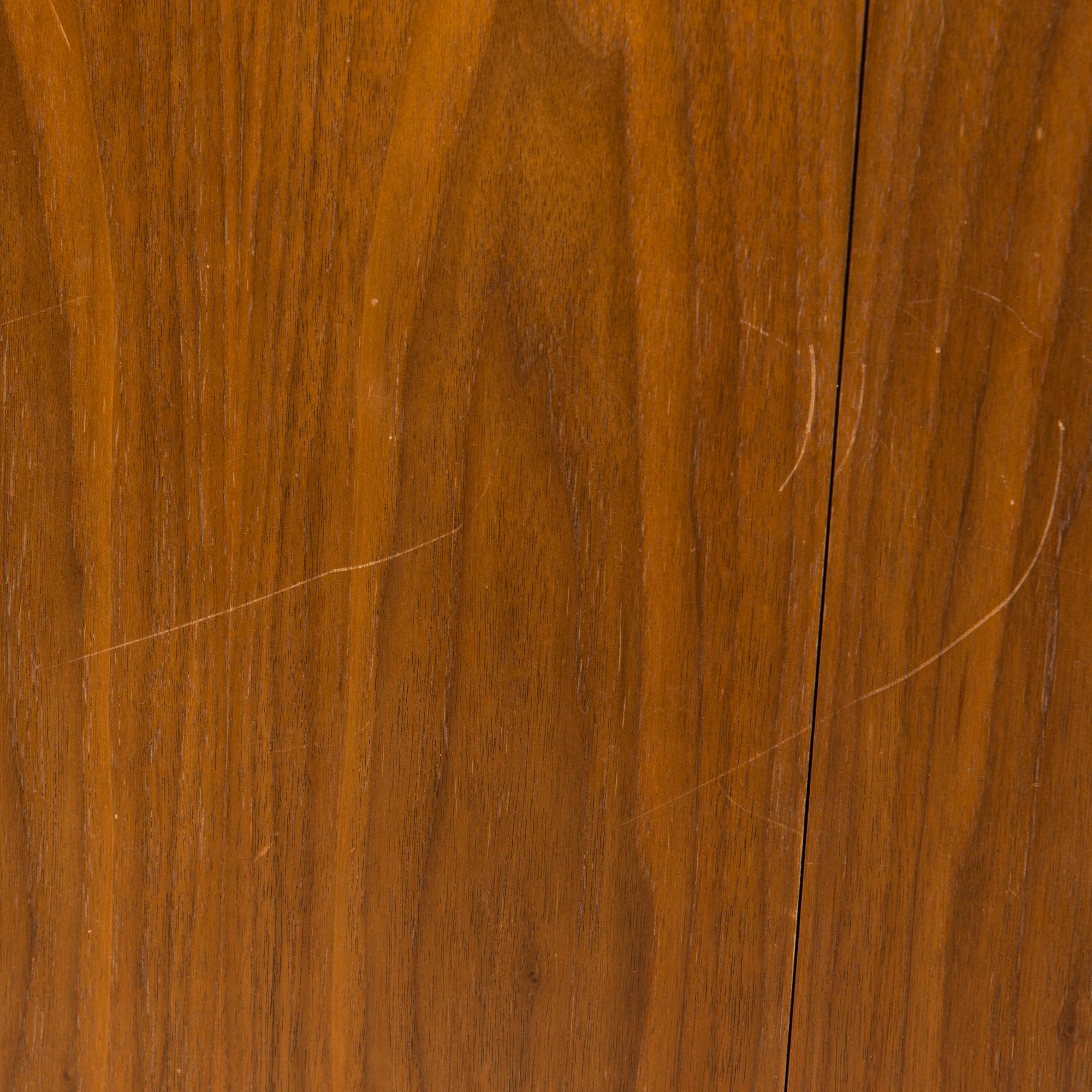 A 1960s teak and oak dining table.