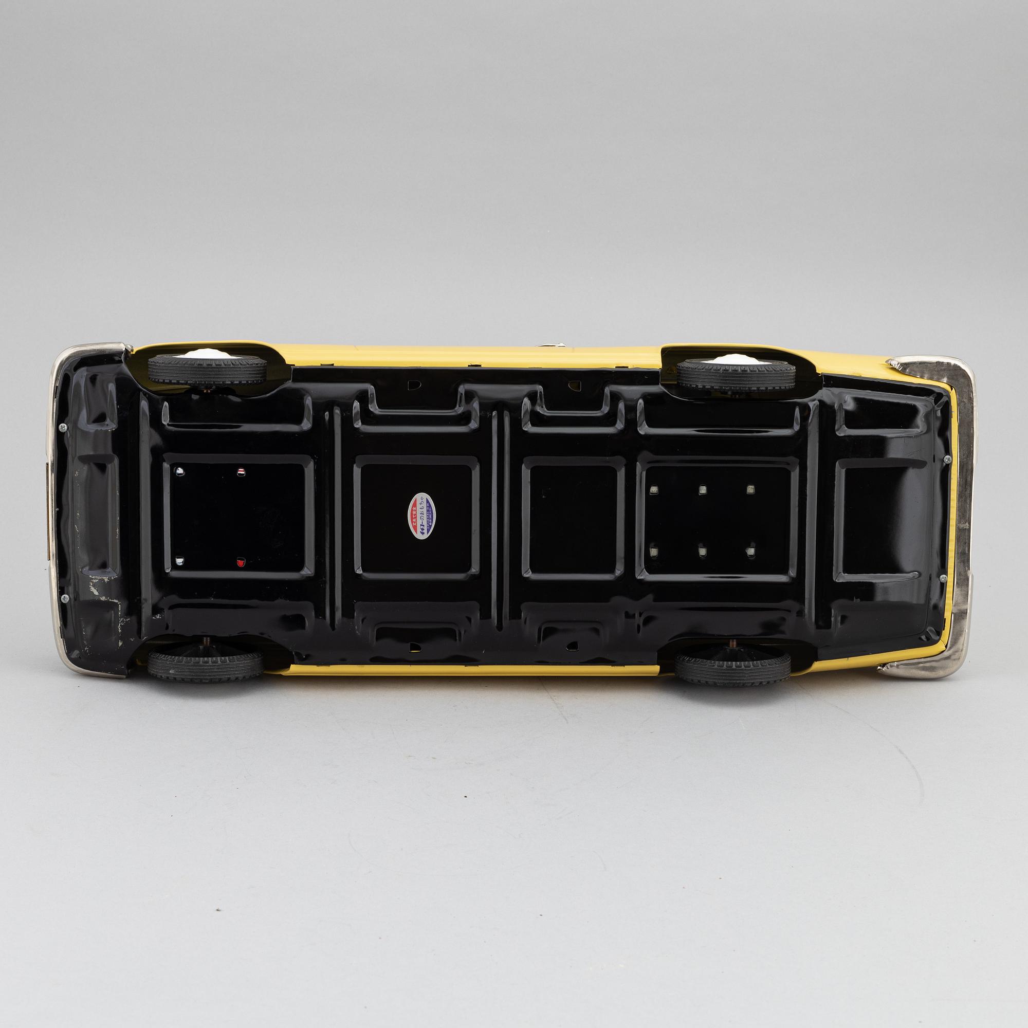A scale tin model of a Mercedes-Benz 300 SE by Ichiko, in a box.