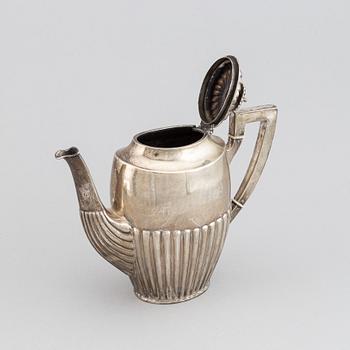 A silver coffee pot, creamer and sugar bowl, AG Dufva, Stockholm 1914.
