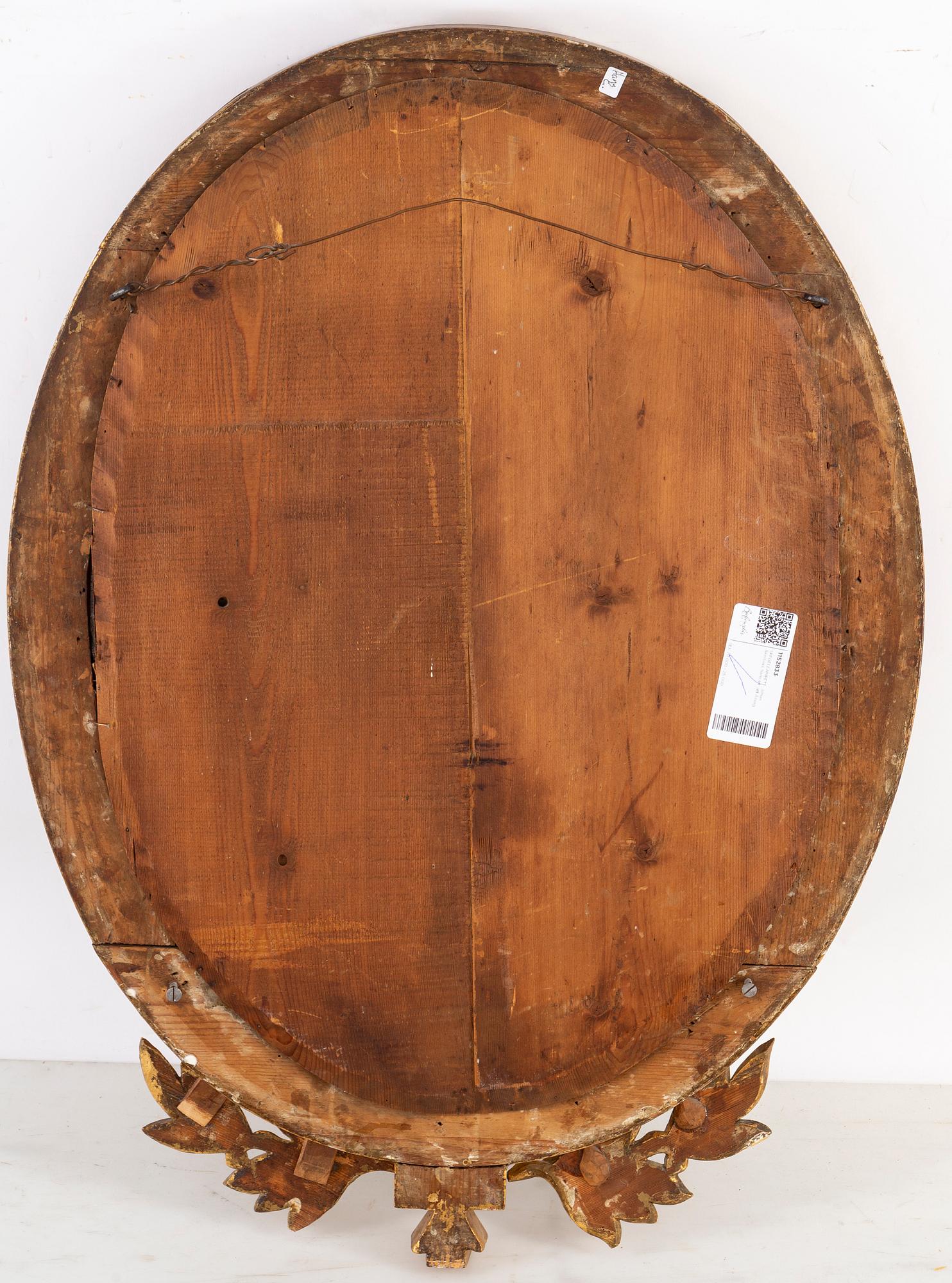 A late Gustavian two-light girandole mirror, circa 1800.