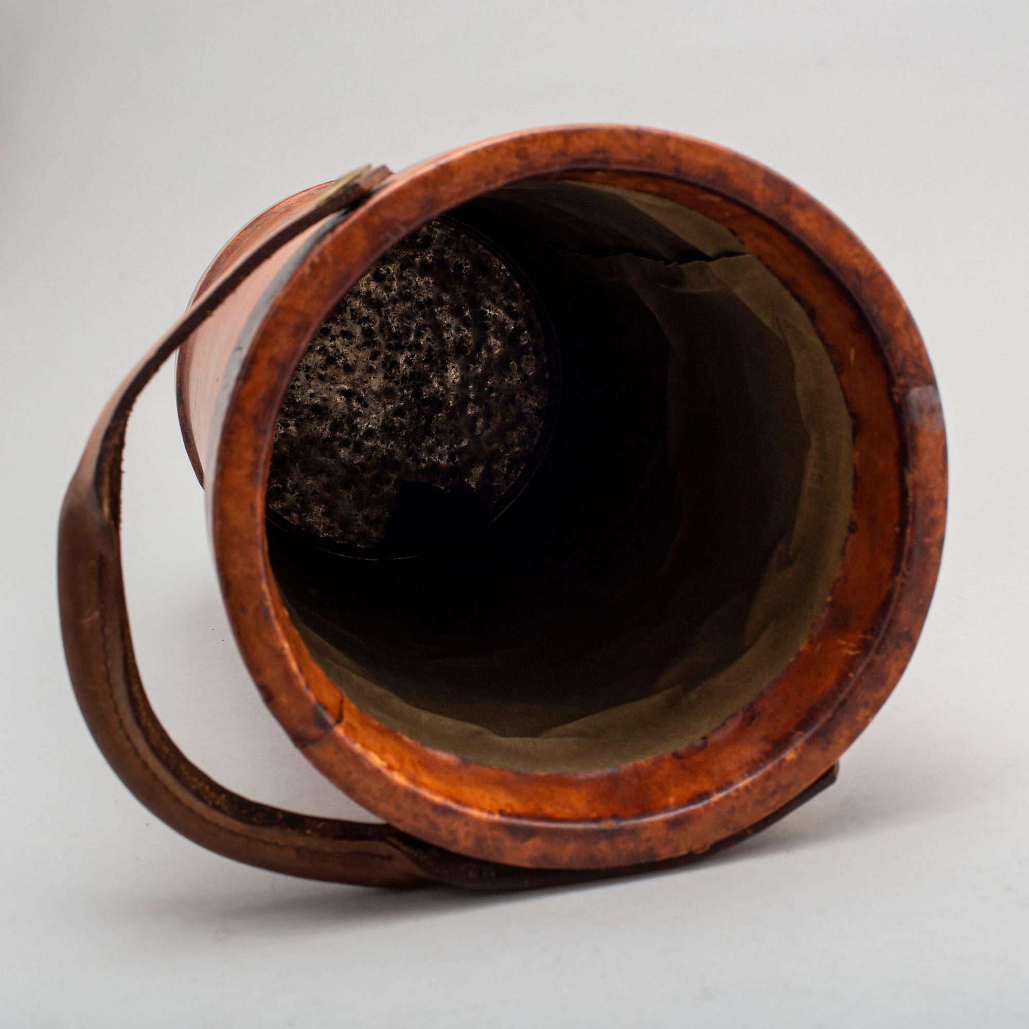A LEATHER UMBRELLA STAND.