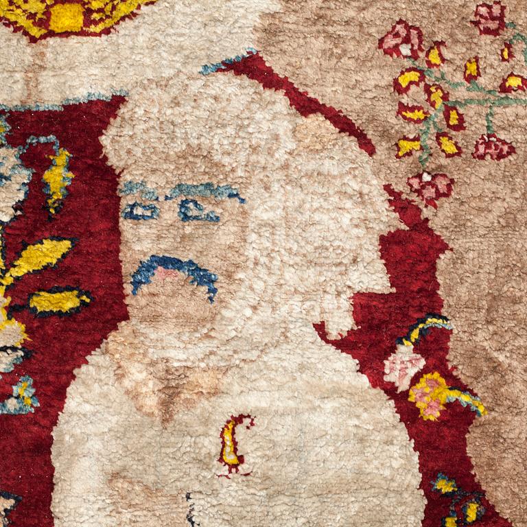 A CARPET, a semi-antique silk Tabriz figural, signed Haddad, 180,5 x 123,5 cm.