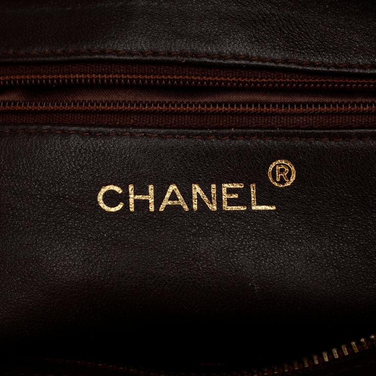 CHANEL, a brown suede purse.