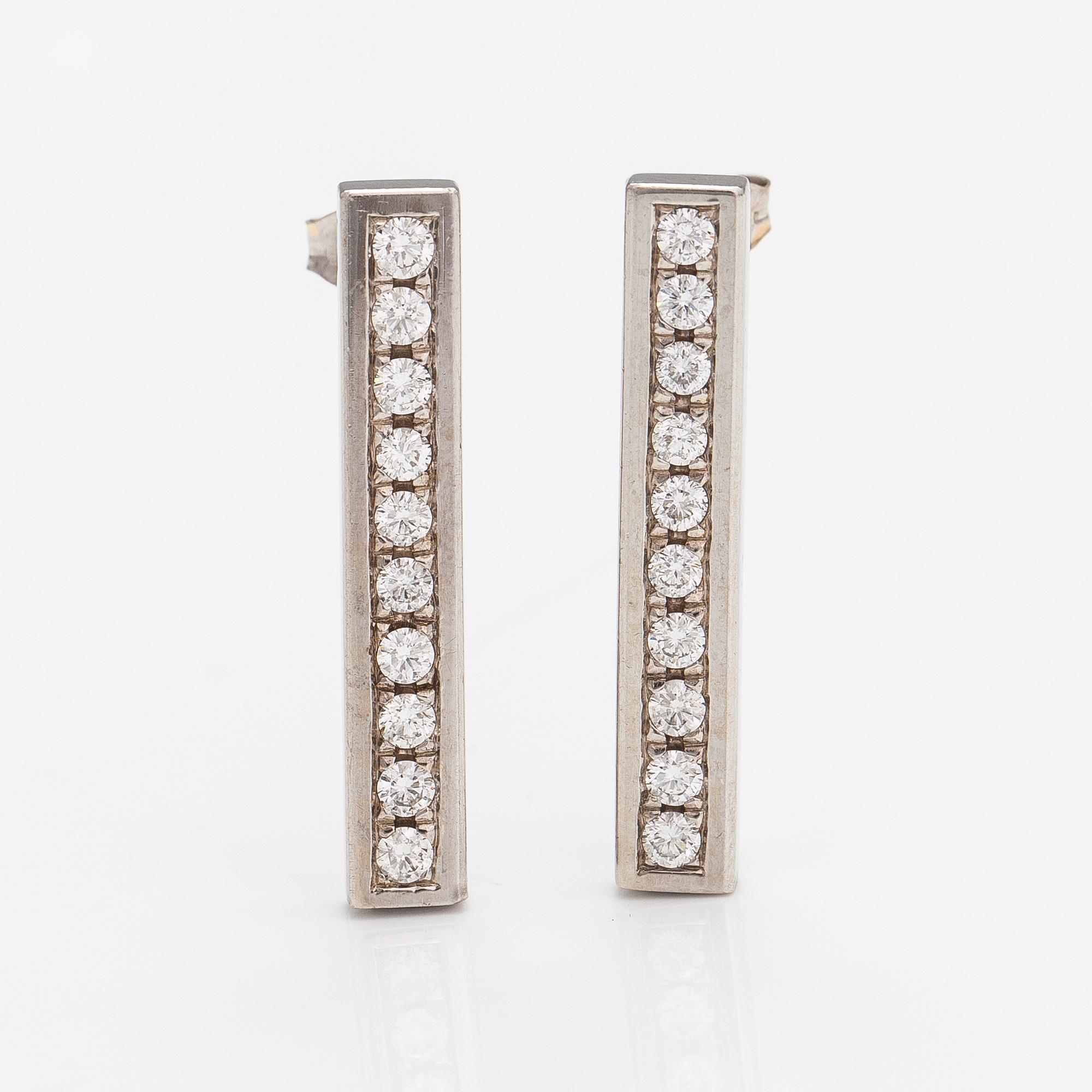 A pair of earrings and a necklace made of 14K white gold with diamonds ca. 4.50 ct in total. JB-Koru Tmi, Espoo 2005.