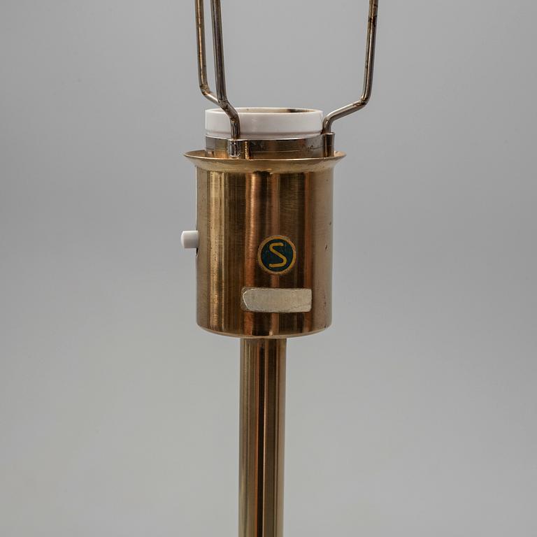 A brass floor light from Nordiska Kompaniet, mid 20th Century.