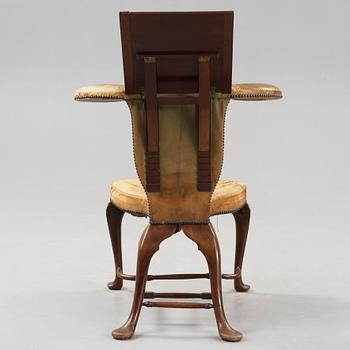 An English 18th century reading and writing chair.