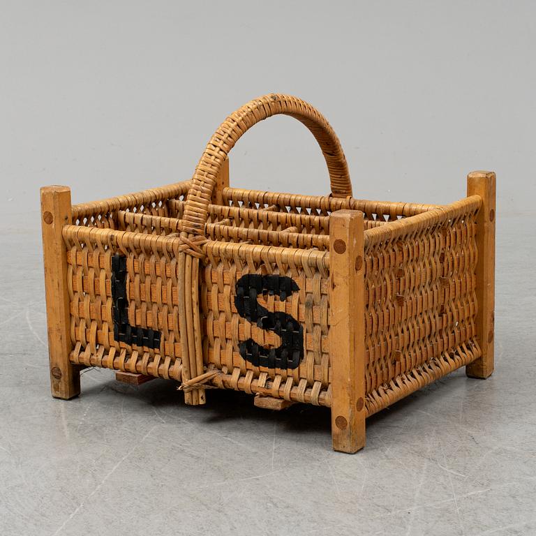 A rattan bottle basket.