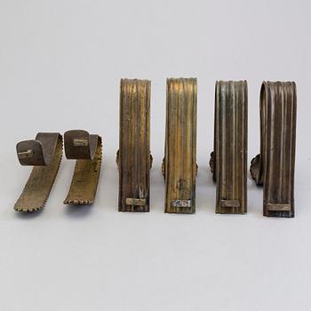SIX BRONZE CURTAIN TIE-BACKS (4+2), 19th century.
