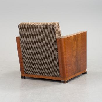 An Art Deco armchair veneered with walnut from the 1930's.