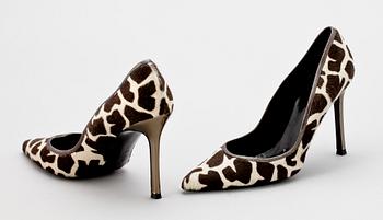 A pair of lady shoes by Versace.