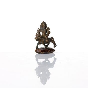 A group of three bronze miniatures sculptures of deities, China and Tibet, 18th Century.