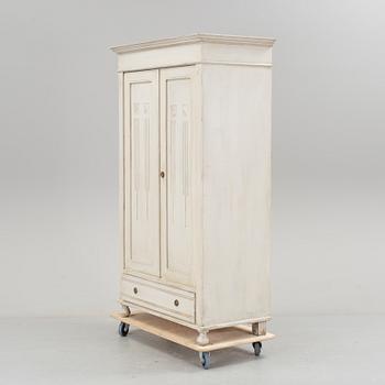 A wardrobe, circa 1900.