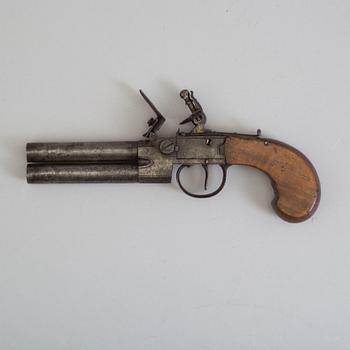 A British over-and-under flintlock pistol circa 1800.