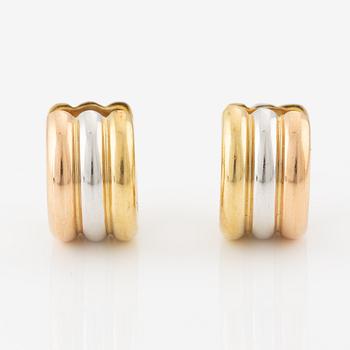 A pair of earrings in 18K gold in three colours.