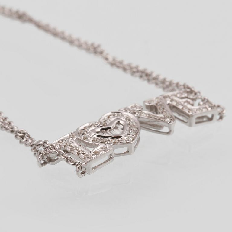 ARMBAND, 18K vitguld med briljant och baguettslipade diamanter ca 0.19 ct. Vikt 2,9 gram.
