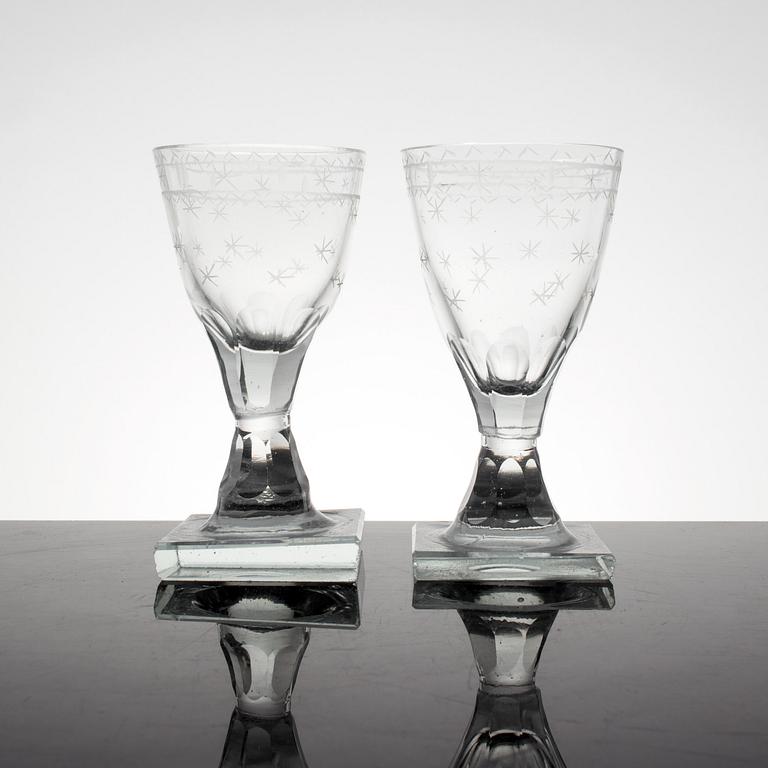 A set of 11 cut and etched liquer glasses, 19th Century.