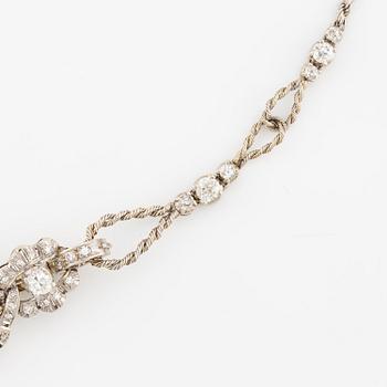 A brooch/necklace combination in 18K white gold set with old- and eight-cut diamonds.