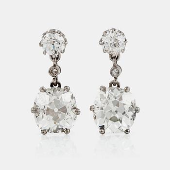 1162. A pair of cushion-cut diamond earrings. Total carat weight of diamonds circa 7.80 cts.
