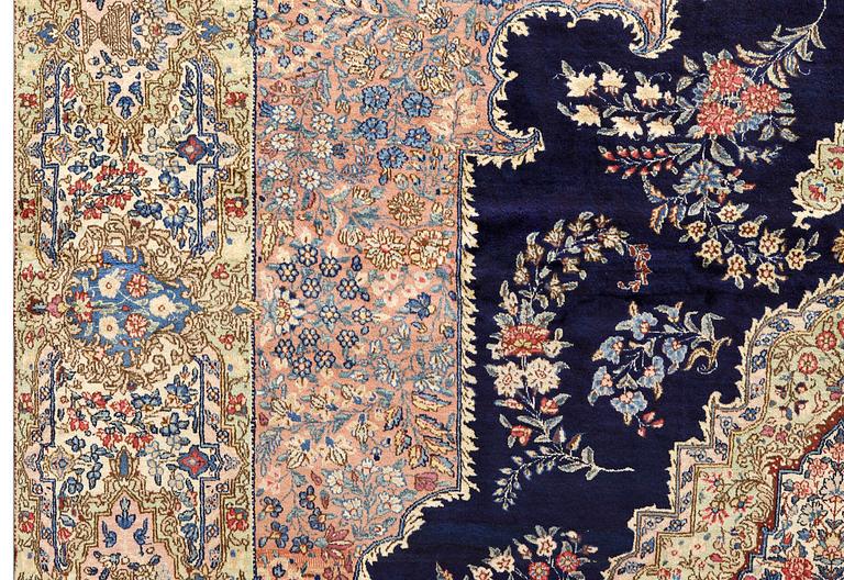 A semi-antique Kerman carpet, approximately 358 x 268 cm.