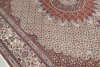 A part silk Moud carpet, approximately 350 x 252 cm.