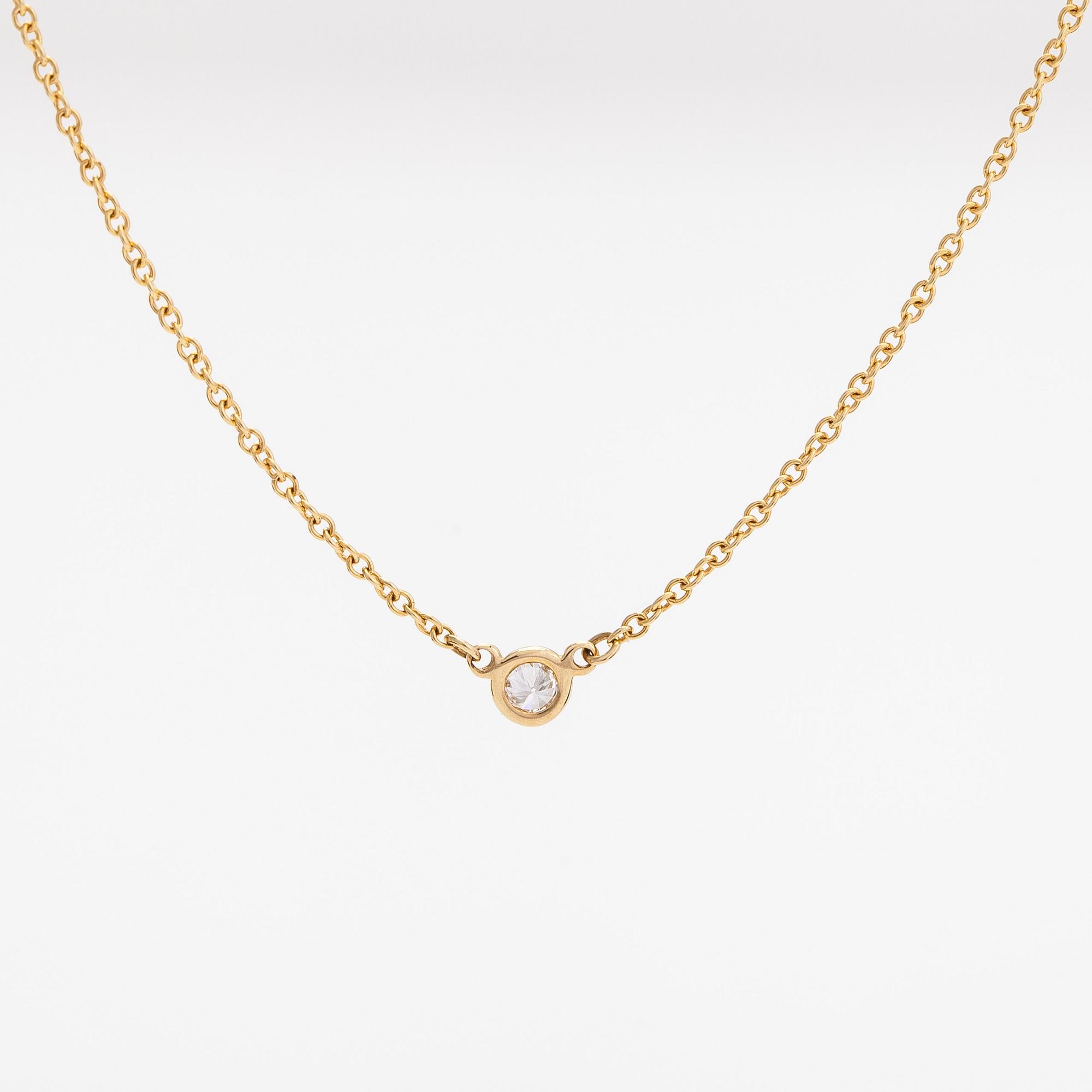 Tiffany & Co, Elsa Peretti, an 18K gold necklace with a ca. 0.05 ct diamond.