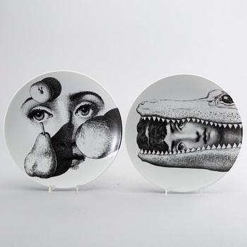 PIERO FORNASETTI, a set of two porcelain plates.