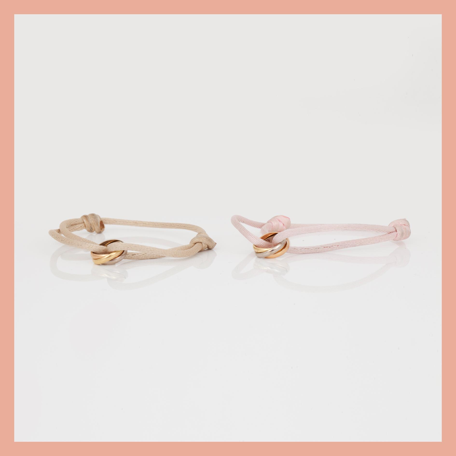 ARMBAND, 2st, tri-colour 18K guld samt tråd, Cartier, signerad och numrerad.