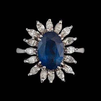 A sapphire and diamond ring. Total carat weight of diamonds circa 1.00 ct.