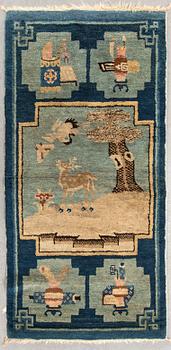 A semaintique Chinese Baotou carpet ca 118x62 cm.