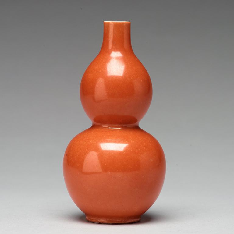 A coral red calebass shaped vase, Qing dynasty with Jiaqing mark (1796-1820).