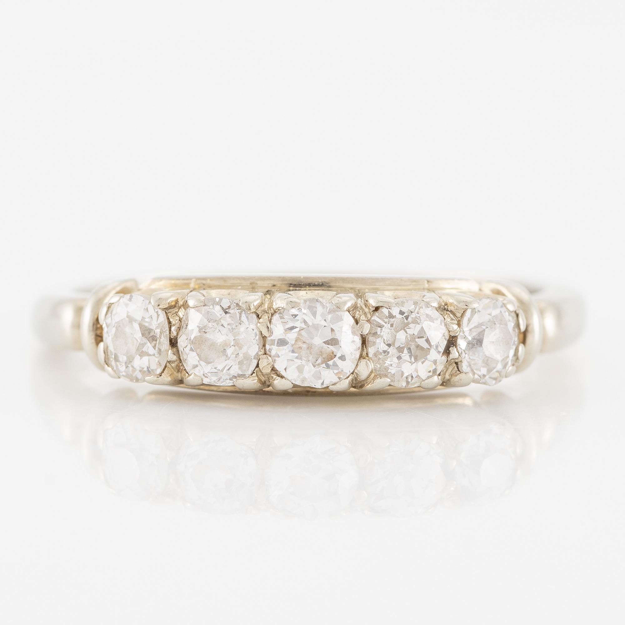 Ring in 18K white gold set with five old-cut diamonds.