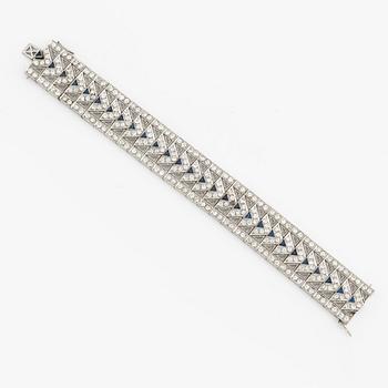 A platinum bracelet with old-cut diamonds and sapphires, likely Bucherer.