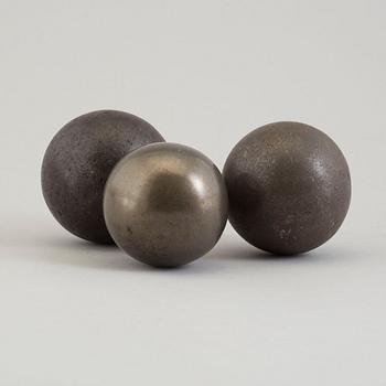 Three 19th century iron balls.