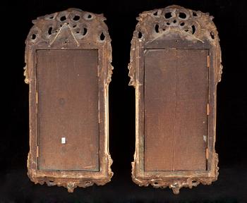 A pair of Swedish Rococo 18th century two-light girandole mirrors.